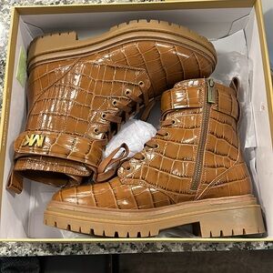 Pair of chestnut Michael Kors booties.